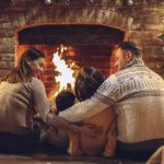Enjoying holiday time around a wood burning fireplace in Dover NY